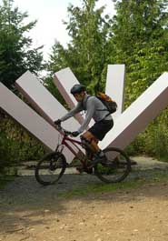 Mark Adriance with Ridge Trail sculpture